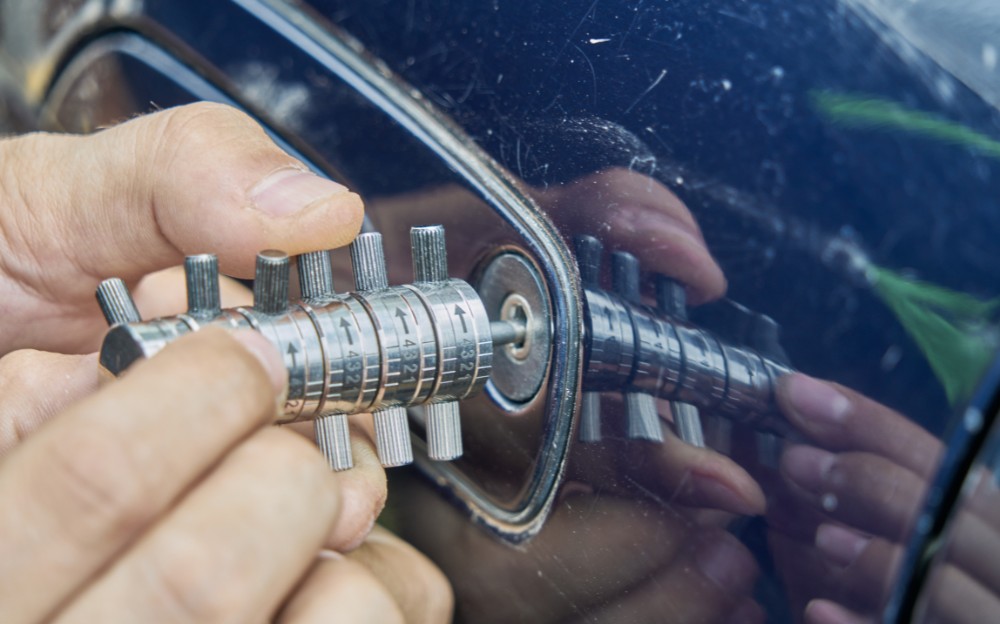 Professional locksmith lock picking a vehicle for a locksmith services in Portland.