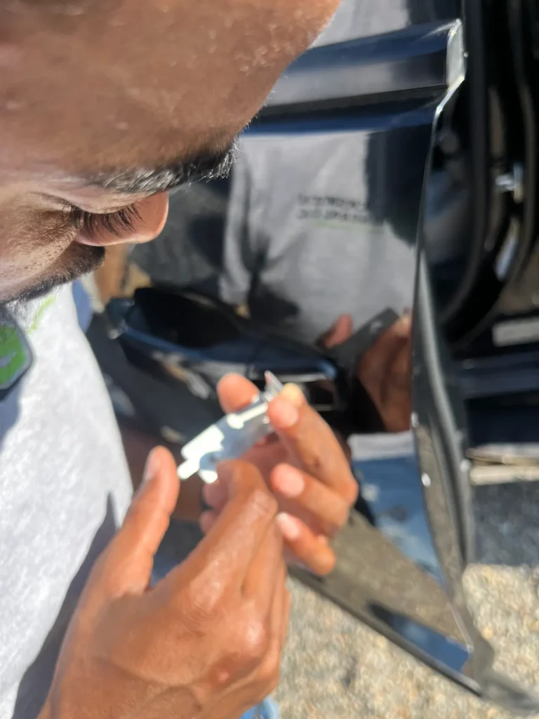 locksmith general technician lock picking a car in Portland for a resident